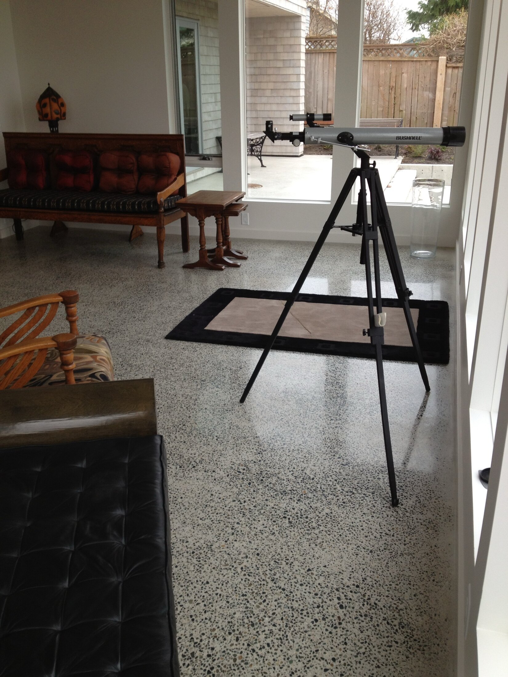 Unnamed residential terrazzo floor detail with telescope and seating.
